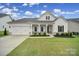 Charming home boasts a well-manicured lawn, white exterior, and inviting front porch at 3255 Split Rail Ln, Lancaster, SC 29720