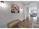 Foyer with hardwood floors, a bench, and decorative artwork on the wall at 3255 Split Rail Ln, Lancaster, SC 29720