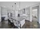 Open kitchen features a large center island with seating and stainless-steel appliances at 3255 Split Rail Ln, Lancaster, SC 29720