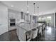 Modern kitchen with large island, stainless steel appliances, and pendant lighting at 3255 Split Rail Ln, Lancaster, SC 29720
