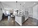 Bright, open kitchen with island seating area and stainless steel appliances at 3255 Split Rail Ln, Lancaster, SC 29720