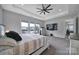 Bright main bedroom featuring a ceiling fan, carpet, and large windows that let in natural light at 3255 Split Rail Ln, Lancaster, SC 29720