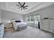 Spacious main bedroom with trey ceiling, carpet, and large windows that let in natural light at 3255 Split Rail Ln, Lancaster, SC 29720