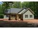 Charming home featuring a covered porch and a freshly painted exterior with black shutters at 3452 Hands Mill Hwy, York, SC 29745