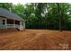 Side exterior of home showing spacious yard with mature trees at 3452 Hands Mill Hwy, York, SC 29745