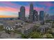 Captivating aerial view showcasing the community's proximity to the iconic Charlotte skyline at dusk at 400 N Church St # 422, Charlotte, NC 28202