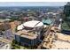 Panoramic aerial view of the vibrant city featuring arena, parking, trees, and modern buildings at 400 N Church St # 422, Charlotte, NC 28202