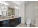 Modern bathroom with double sink vanity, walk-in shower and modern fixtures offers a spa-like experience at 400 N Church St # 422, Charlotte, NC 28202