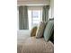 Elegant bedroom with plush pillows and decorative curtains offers a serene and comfortable retreat at 400 N Church St # 422, Charlotte, NC 28202