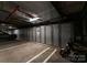 Organized parking garage with storage lockers and dedicated spots for vehicles and motorcycles at 400 N Church St # 422, Charlotte, NC 28202
