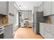 Eat-in kitchen with stainless steel appliances, granite countertops, and space for a small desk at 400 N Church St # 422, Charlotte, NC 28202