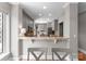 Bright kitchen area with granite countertop, ample gray cabinets, and stainless steel appliances at 400 N Church St # 422, Charlotte, NC 28202