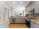 Kitchen featuring granite countertops, stainless steel appliances, and gray cabinets at 400 N Church St # 422, Charlotte, NC 28202