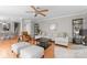 Spacious living room featuring hardwood floors, neutral paint, and comfortable seating, open to dining area at 400 N Church St # 422, Charlotte, NC 28202