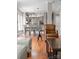Open living area with wood floors, modern lighting, and a cozy sitting area adjacent to the kitchen at 400 N Church St # 422, Charlotte, NC 28202