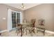 Cozy dining area featuring elegant chairs, a stylish round table, and sliding glass doors for natural light and access at 401 Yadkin St, Granite Quarry, NC 28072