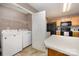Kitchen connected to laundry room providing convenience and utility at 401 Yadkin St, Granite Quarry, NC 28072