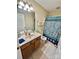 Bright bathroom with a vanity, toilet, and shower, offering a clean and functional space at 401 Yadkin St, Granite Quarry, NC 28072