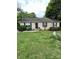 Inviting home with a well-maintained lawn, beautiful landscaping, and charming curb appeal at 401 Yadkin St, Granite Quarry, NC 28072