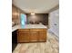 Spacious kitchen island with ample cabinet space and a view into the dining area at 401 Yadkin St, Granite Quarry, NC 28072