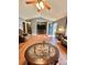 Open living room with hard wood floors, ceiling fan, and front door view at 401 Yadkin St, Granite Quarry, NC 28072