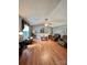 Spacious living room with wood flooring, a ceiling fan, and comfortable seating at 401 Yadkin St, Granite Quarry, NC 28072