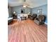 Bright living room featuring hard wood floors, neutral walls, and comfortable seating at 401 Yadkin St, Granite Quarry, NC 28072