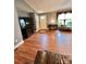 Cozy living room showcasing wood floors, a media center, and ample natural light at 401 Yadkin St, Granite Quarry, NC 28072