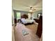Spacious main bedroom with carpet flooring, windows, and classic furnishings, perfect for relaxation at 401 Yadkin St, Granite Quarry, NC 28072