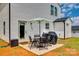 Outdoor patio featuring a table, chairs, umbrella and grill for relaxed outdoor living at 415 Kickapoo Ave, Gastonia, NC 28056