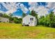 Large backyard offers privacy and space for outdoor living, surrounded by mature trees at 415 Kickapoo Ave, Gastonia, NC 28056