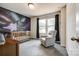 Charming bedroom with a galaxy mural, crib, and comfortable rocking chair at 415 Kickapoo Ave, Gastonia, NC 28056