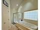 Bright bathroom featuring a soaking tub and separate glass-enclosed shower at 4230 Berry Hill Ct, Concord, NC 28025