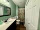 Charming bathroom with an updated vanity, shower, and closet, featuring a modern aesthetic at 4230 Berry Hill Ct, Concord, NC 28025