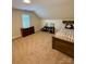 Bedroom with a twin bed, ceiling fan, and carpet floors at 4230 Berry Hill Ct, Concord, NC 28025