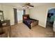 Bedroom with a twin bed, ceiling fan, and black and white curtains at 4230 Berry Hill Ct, Concord, NC 28025