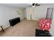 Large bedroom with neutral carpet, a red-patterned bedspread and a dark dresser at 4230 Berry Hill Ct, Concord, NC 28025