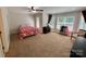Spacious bedroom with large windows, ceiling fan, and walk-in closet at 4230 Berry Hill Ct, Concord, NC 28025