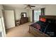 Bedroom with a twin bed, ceiling fan, and black and white curtains at 4230 Berry Hill Ct, Concord, NC 28025