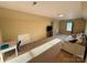 Bonus room with carpet, TV, and large sofa at 4230 Berry Hill Ct, Concord, NC 28025