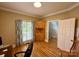 Cozy office with hardwood floors, built-in shelving, natural light from the window, and stylish decor at 4230 Berry Hill Ct, Concord, NC 28025