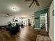 Inviting living room with wood floors flowing into an open kitchen, ideal for entertaining and everyday living at 4230 Berry Hill Ct, Concord, NC 28025