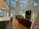 Spacious living room with high ceilings, a fireplace, a TV, hardwood floors, and leather sofas at 4230 Berry Hill Ct, Concord, NC 28025