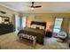 Comfortable main bedroom with a large bed, ample natural light, and a ceiling fan at 4230 Berry Hill Ct, Concord, NC 28025