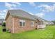 Backyard featuring a deck, green grass and houses at 5052 Ashley Pl, Bessemer City, NC 28016