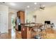 Open concept kitchen with an island and seating, granite countertops, and stainless steel refrigerator at 5052 Ashley Pl, Bessemer City, NC 28016