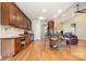Spacious kitchen featuring wood cabinets, granite counters, stainless appliances, and a breakfast bar at 5052 Ashley Pl, Bessemer City, NC 28016