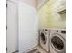 Convenient laundry room with washer, dryer, and shelving for ample storage space at 5052 Ashley Pl, Bessemer City, NC 28016