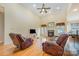 Cozy living room boasts hardwood floors, a fireplace, and comfortable leather seating at 5052 Ashley Pl, Bessemer City, NC 28016