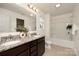 Bathroom featuring double sinks with granite counters, with a shower and bathtub at 5160 Thomasville Dr # 123, Belmont, NC 28012